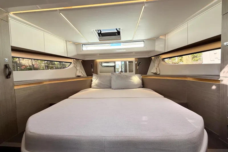 Slide: The Image of Luxurious interior cabin of 2024 Jeanneau NC 1295 Fly yacht, featuring a spacious bed. - 41