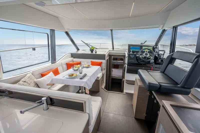 Slide: The Image of Manufacturer Provided Image: Family enjoying leisure time on a 2025 Jeanneau NC 1295 Fly yacht in calm waters. - 5