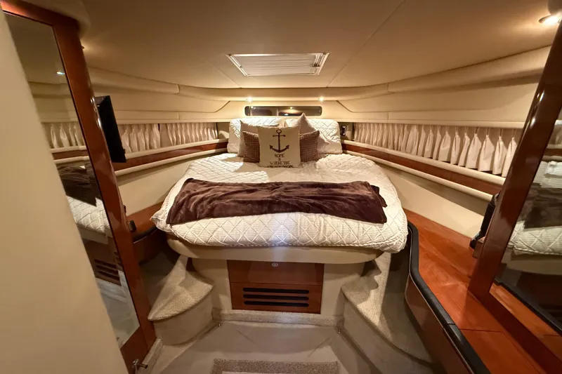 Slide: The Image of Luxurious cabin interior of 2004 Sea Ray Sundancer 460 yacht with cozy bedding. - 13