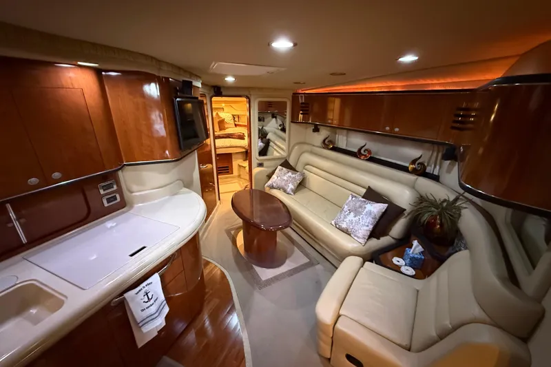 Slide: The Image of Luxurious interior of 2004 Sea Ray Sundancer 460 yacht with elegant seating and wood finishes. - 15