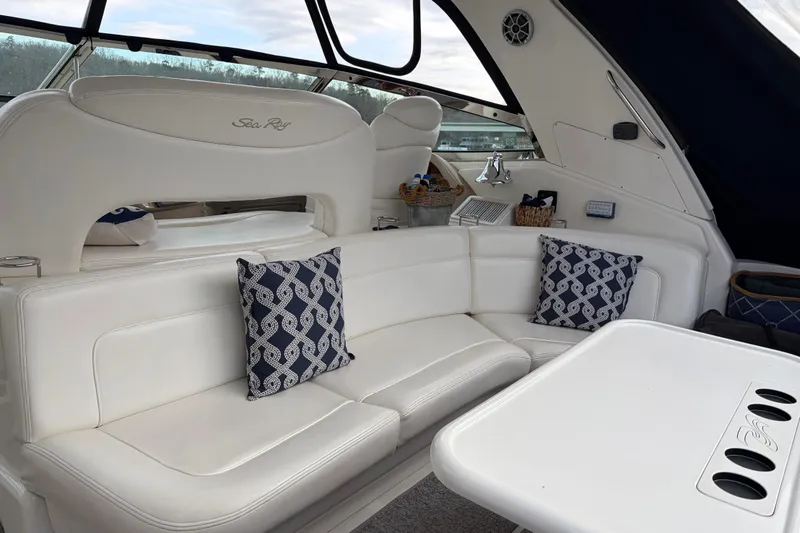 Slide: The Image of Luxurious interior of 2004 Sea Ray Sundancer 460 yacht with white seating and decorative pillows. - 19