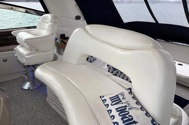 Slide: The Image of Luxurious interior of 2004 Sea Ray Sundancer 460 with white leather seating. - 22
