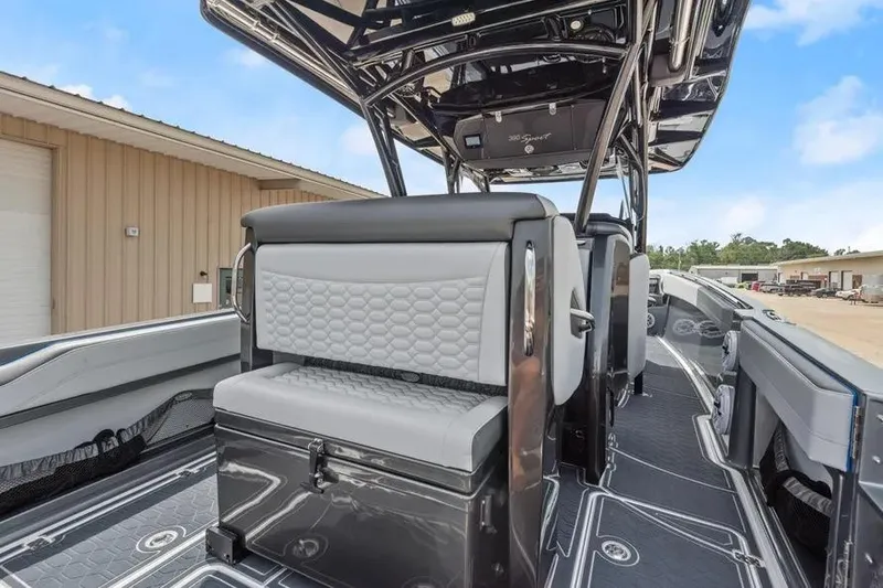 Slide: The Image of 2023 Nor-Tech 390 Sport Center Console boat interior with sleek seating and modern design. - 10