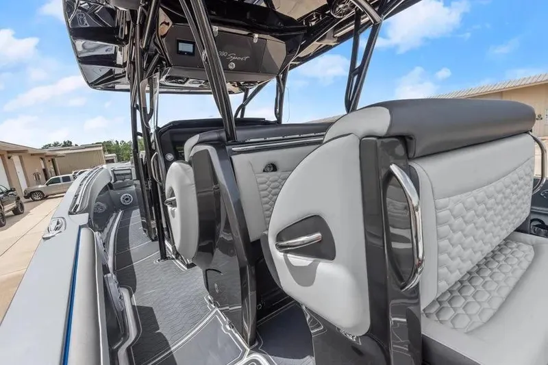 Slide: The Image of 2023 Nor-Tech 390 Sport Center Console interior with sleek seating and modern design. - 11
