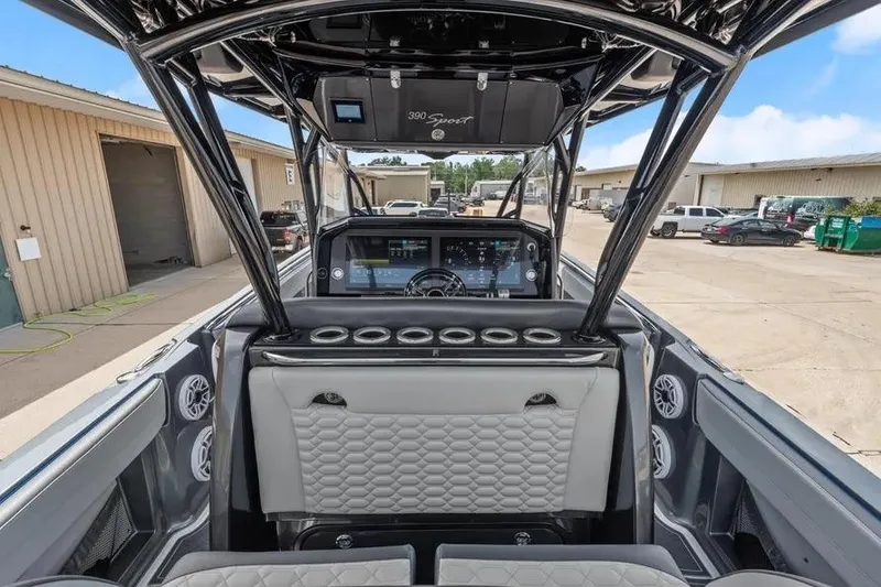 Slide: The Image of 2023 Nor-Tech 390 Sport Center Console interior with modern dashboard and seating. - 12
