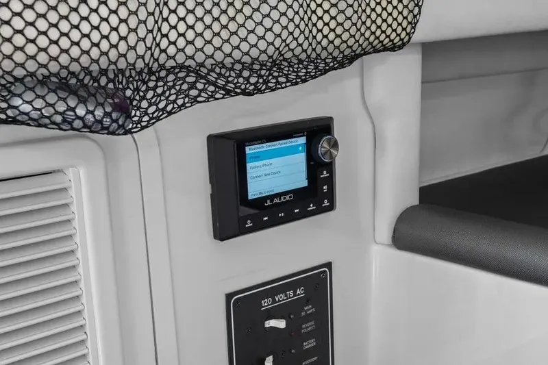 Slide: The Image of Interior of 2023 Nor-Tech 390 Sport Center Console with JL Audio system and AC controls. - 16