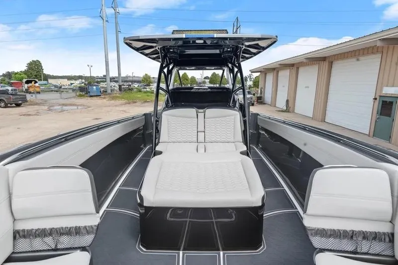 Slide: The Image of 2023 Nor-Tech 390 Sport Center Console boat with sleek seating and modern design. - 5