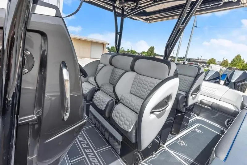Slide: The Image of 2023 Nor-Tech 390 Sport Center Console interior with luxurious seating and modern design. - 7