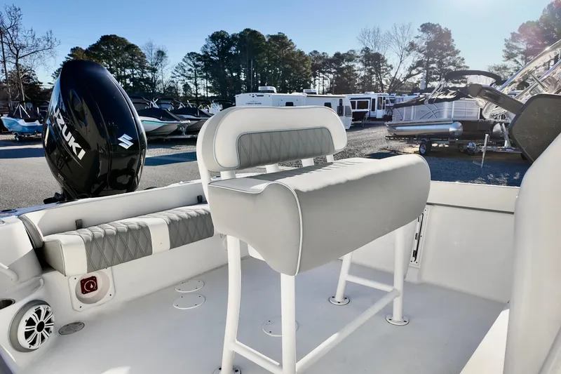 Slide: The Image of 2025 ALK2 Powerboats 23 CRX interior with Suzuki engine, featuring sleek seating and modern design. - 10