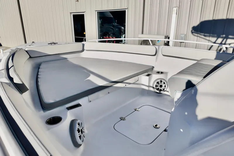 Slide: The Image of 2025 ALK2 Powerboats 23 CRX interior with cushioned seating and modern design. - 14