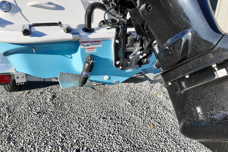 Slide: The Image of 2025 ALK2 Powerboats 23 CRX rear view with motor and blue hull. - 6