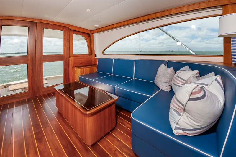 Slide: The Image of Interior of 2019 Jarrett Bay 67 Custom yacht with blue leather couch. - 18