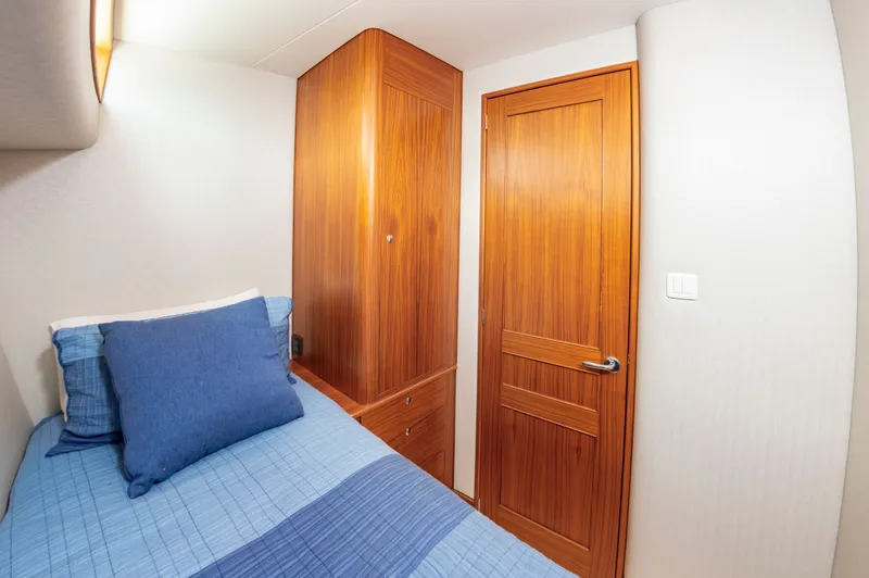 Slide: The Image of 2019 Jarrett Bay 67 Custom yacht cabin interior with wooden door. - 40