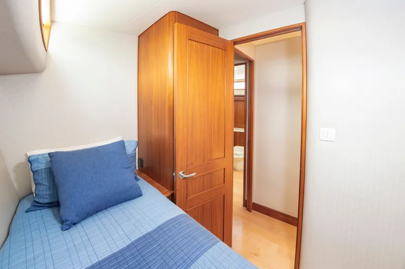 Slide: The Image of Interior of 2019 Jarrett Bay 67 Custom yacht, bedroom with wooden door. - 41