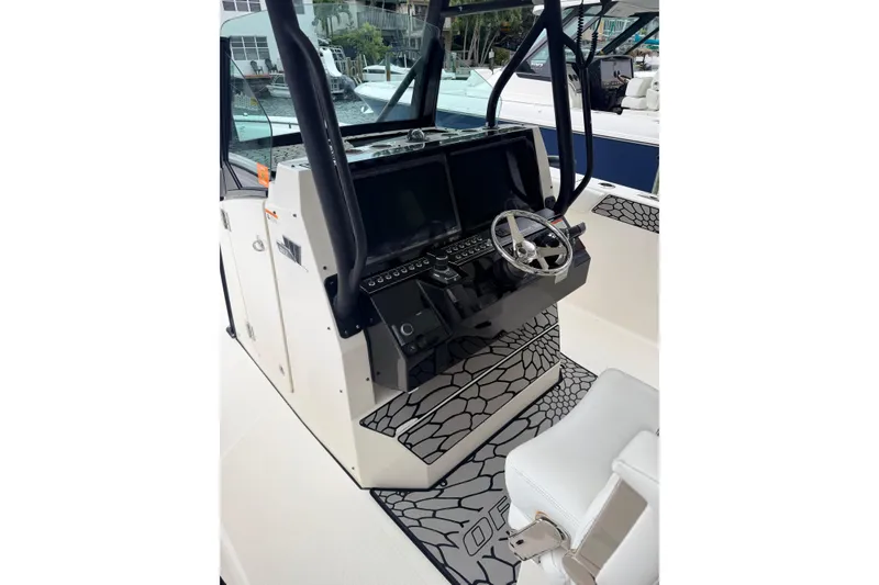 Slide: The Image of 2019 Wellcraft 352 Fisherman boat helm with modern controls and steering wheel. - 10