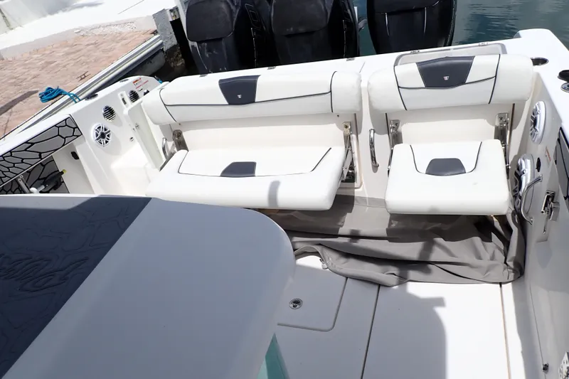 Slide: The Image of 2019 Wellcraft 352 Fisherman boat interior with white seating and modern design. - 15