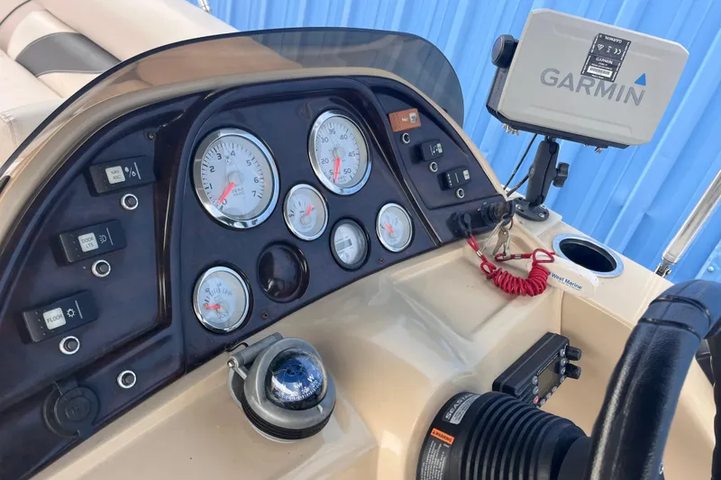 Slide: The Image of 2016 SunChaser Classic Fish 8522 Cruise-N-Fish dashboard with Garmin GPS and control panel. - 12