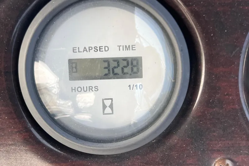 Slide: The Image of Elapsed time gauge showing 322.8 hours on SunChaser Classic Fish 8522 Cruise-N-Fish, 2016 model. - 13