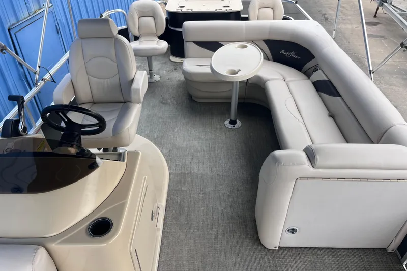 Slide: The Image of 2016 SunChaser Classic Fish 8522 Cruise-N-Fish pontoon boat interior with seating and steering console. - 16