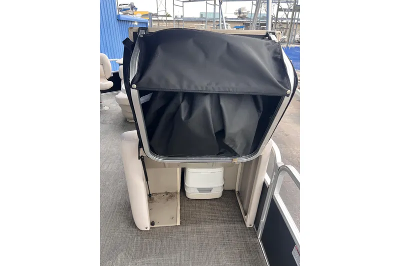 Slide: The Image of 2016 SunChaser Classic Fish 8522 Cruise-N-Fish boat interior with storage compartment. - 17