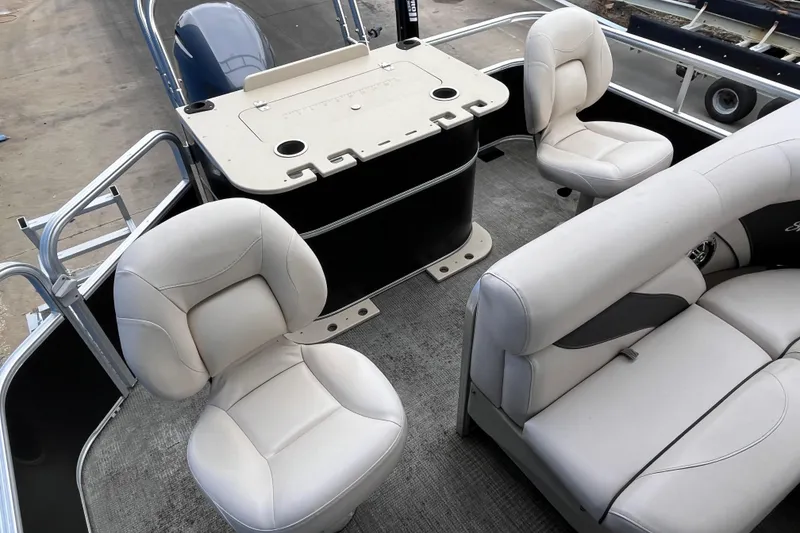 Slide: The Image of 2016 SunChaser Classic Fish 8522 Cruise-N-Fish boat interior with plush seating and fishing station. - 19