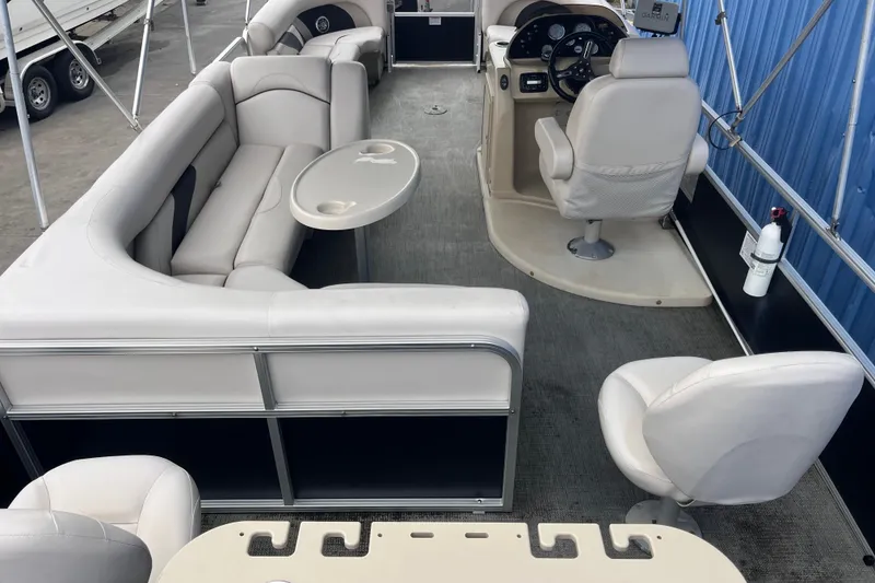 Slide: The Image of 2016 SunChaser Classic Fish 8522 Cruise-N-Fish pontoon boat interior with seating and steering console. - 20