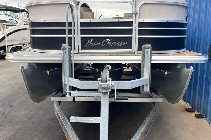 Slide: The Image of 2016 SunChaser Classic Fish 8522 Cruise-N-Fish pontoon boat on trailer. - 23