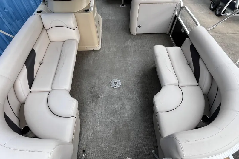 Slide: The Image of 2016 SunChaser Classic Fish 8522 Cruise-N-Fish interior with white seating and spacious layout. - 6