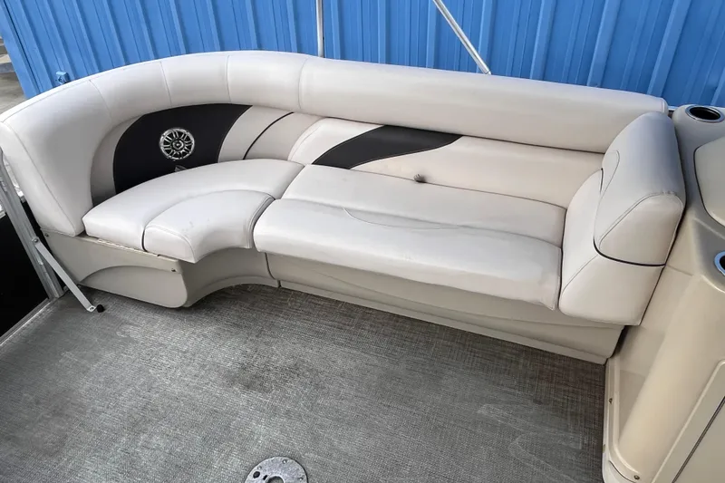 Slide: The Image of 2016 SunChaser Classic Fish 8522 Cruise-N-Fish boat seating, white and black upholstery. - 8