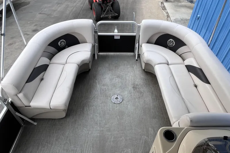 Slide: The Image of 2016 SunChaser Classic Fish 8522 Cruise-N-Fish pontoon boat interior with plush seating. - 9