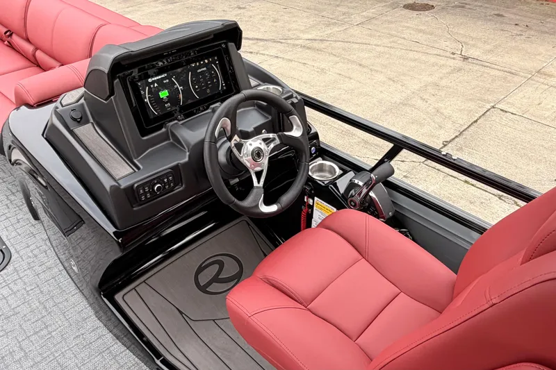 Slide: The Image of 2026 Regency 250 DL boat cockpit with red seating and modern dashboard. - 6