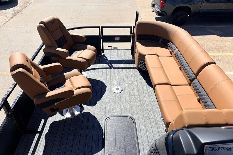 Slide: The Image of 2026 Ranger 223FC boat interior with luxurious tan seating and spacious layout. - 11