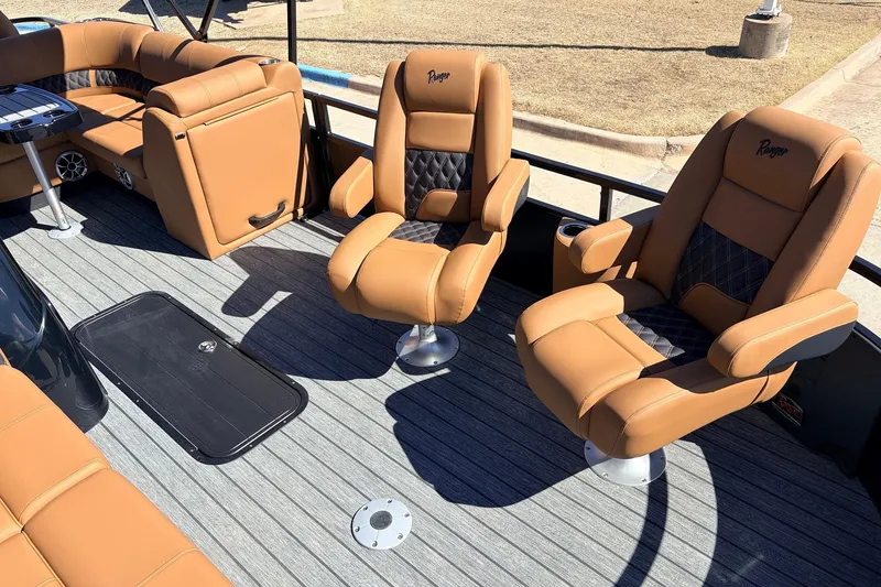 Slide: The Image of Luxurious seating on 2026 Ranger 223FC boat with tan leather and diamond stitching. - 13