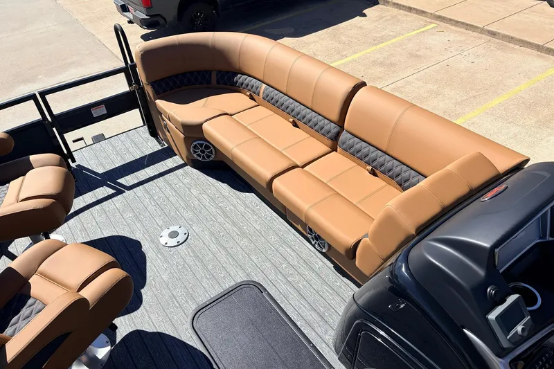 Slide: The Image of 2026 Ranger 223FC boat interior with tan seating and modern design. - 14