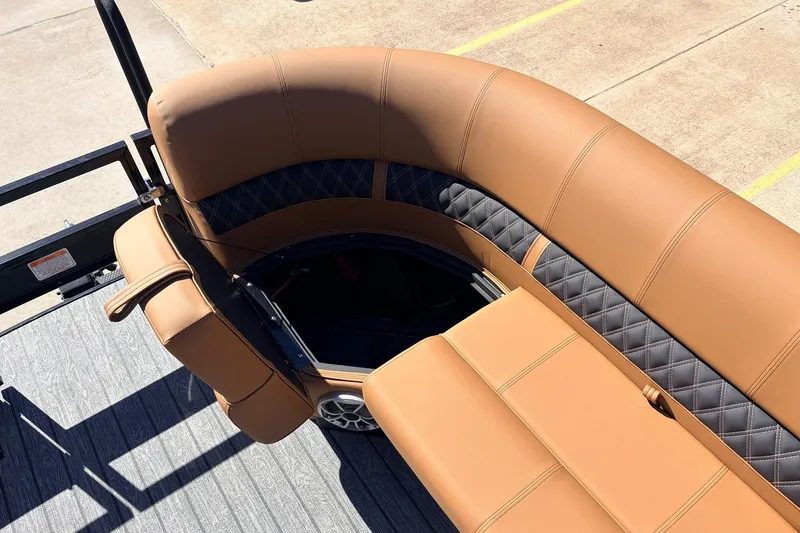 Slide: The Image of Luxurious seating on 2026 Ranger 223FC boat with tan and black upholstery. - 17