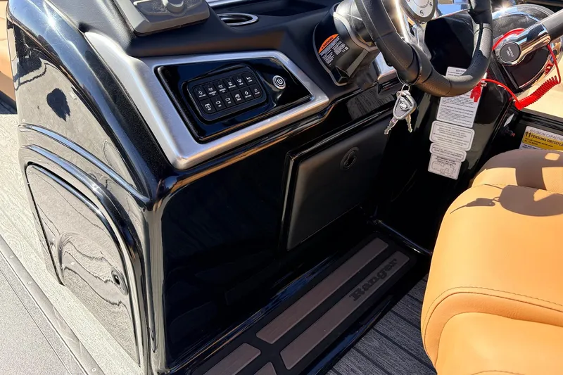 Slide: The Image of 2026 Ranger 223FC boat dashboard with steering wheel and control panel. - 30