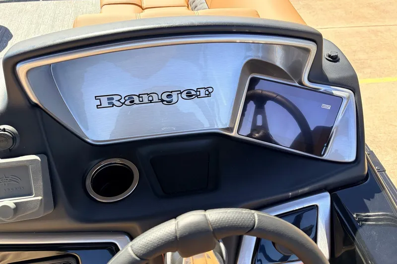 Slide: The Image of 2026 Ranger 223FC dashboard with steering wheel and digital display. - 34