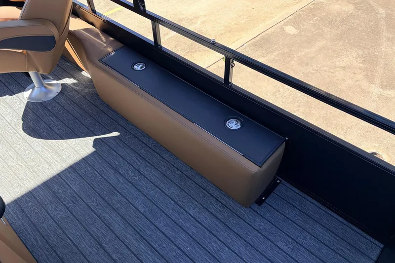 Slide: The Image of 2026 Ranger 223FC boat interior with brown seating and gray flooring. - 37