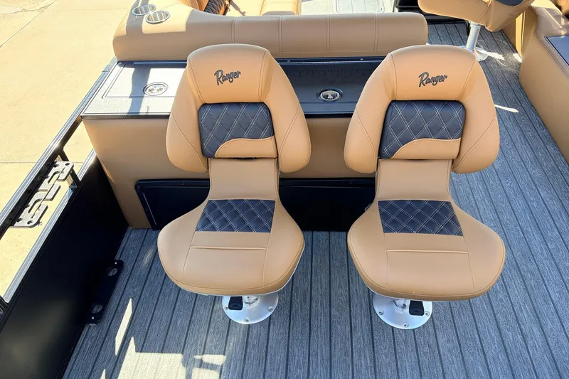 Slide: The Image of 2026 Ranger 223FC boat seats with tan and black diamond stitching design. - 42