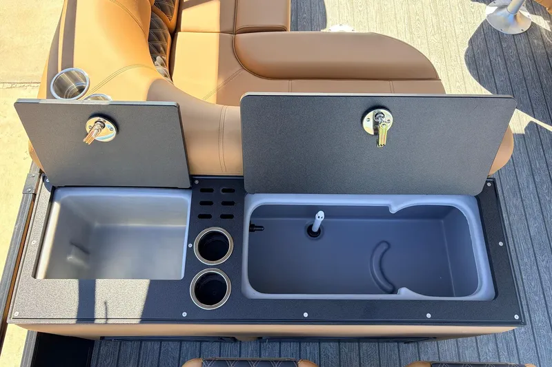 Slide: The Image of 2026 Ranger 223FC boat interior with storage compartments and cup holders. - 46