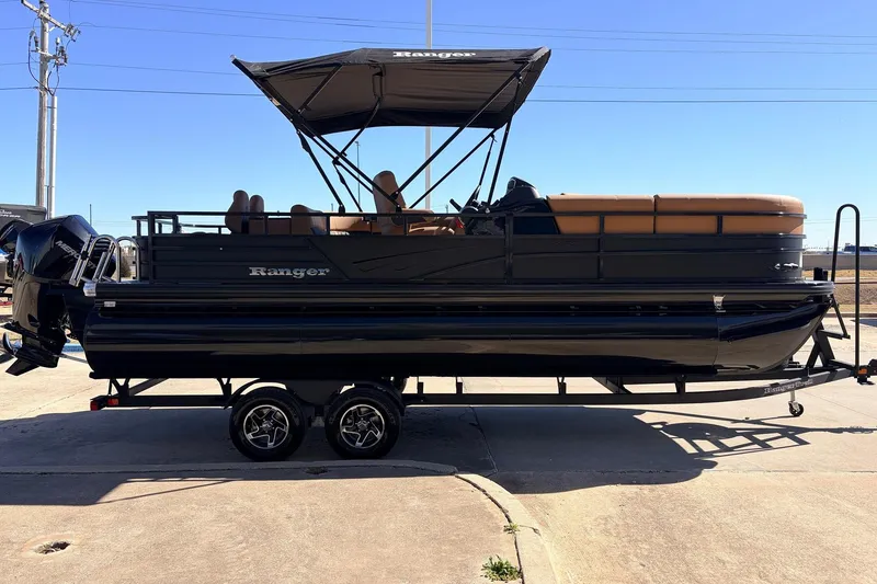 Slide: The Image of 2026 Ranger 223FC pontoon boat on trailer, featuring sleek design and canopy. - 5