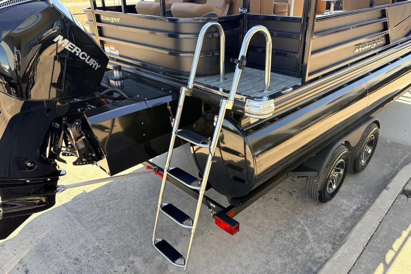 Slide: The Image of 2026 Ranger 223FC boat with Mercury engine and ladder on trailer. - 9