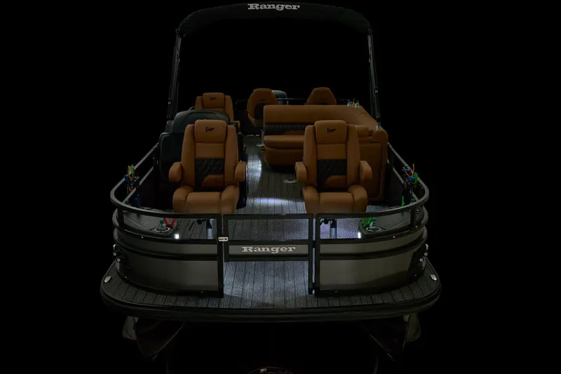 Slide: The Image of 2026 Ranger 220F boat interior with gray seating and flooring. - 10