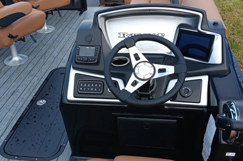 Slide: The Image of 2026 Ranger 223FC boat dashboard with steering wheel, controls, and seating. - 4
