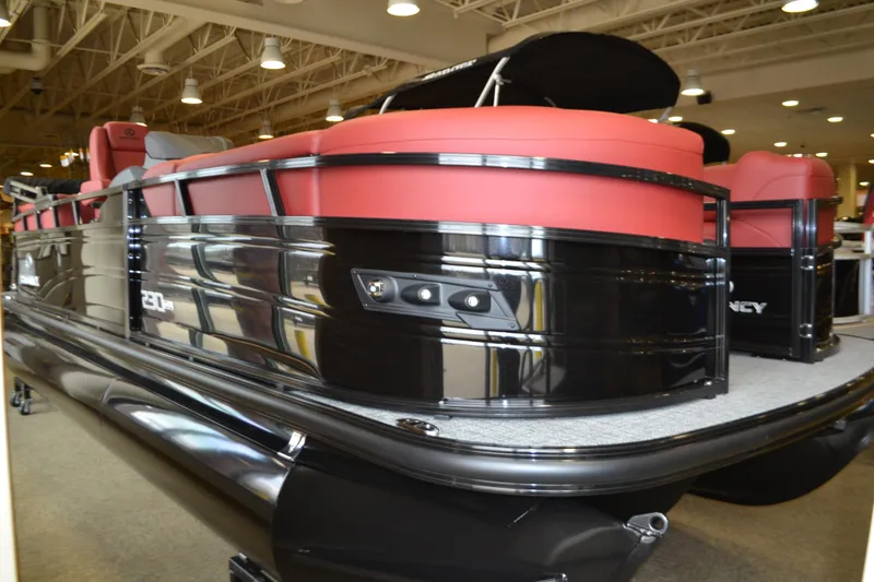 Slide: The Image of Luxurious interior of 2026 Regency 230 DL pontoon boat with red seating. - 5