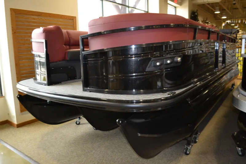 Slide: The Image of Top view of 2026 Regency 230 DL pontoon boat with brown seating and sleek design. - 6