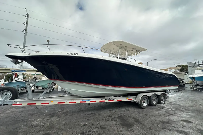 The Image of 2007 Century 3200 Center Console boat on trailer, overcast sky background. - 0