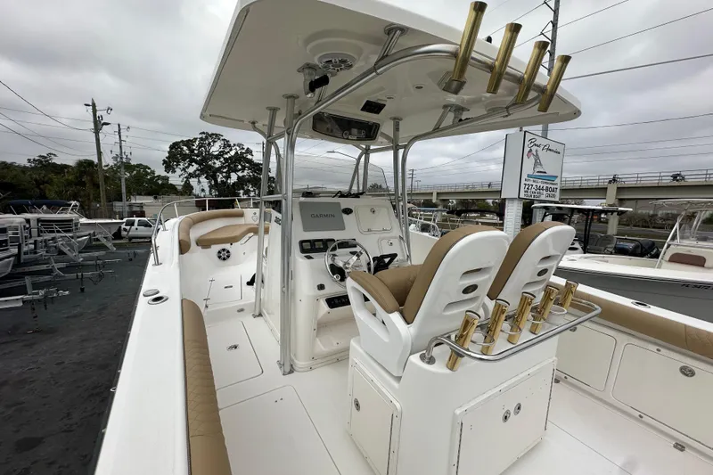 Slide: The Image of 2007 Century 3200 Center Console boat with dual seats and fishing rod holders. - 14
