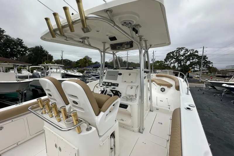 Slide: The Image of 2007 Century 3200 Center Console boat with dual seats and fishing rod holders. - 15
