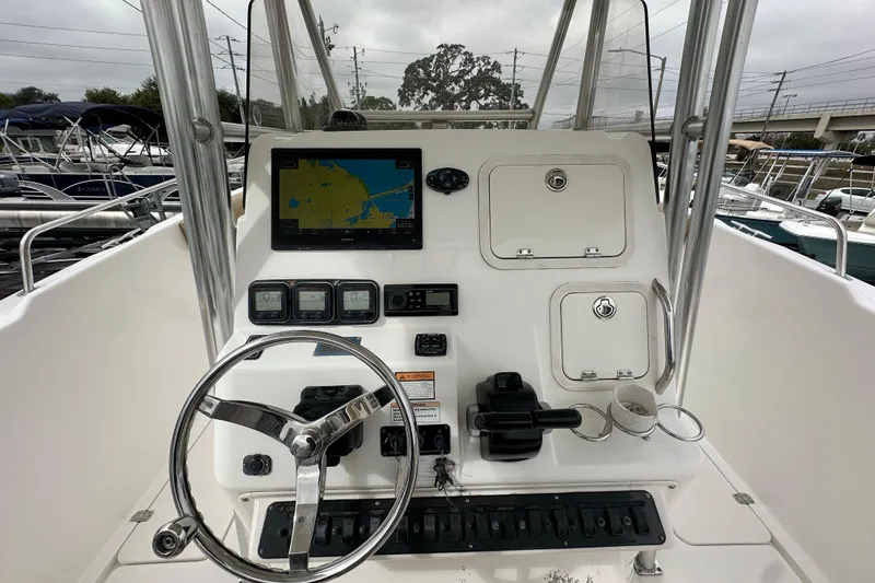 Slide: The Image of 2007 Century 3200 Center Console boat dashboard with navigation and control systems. - 19